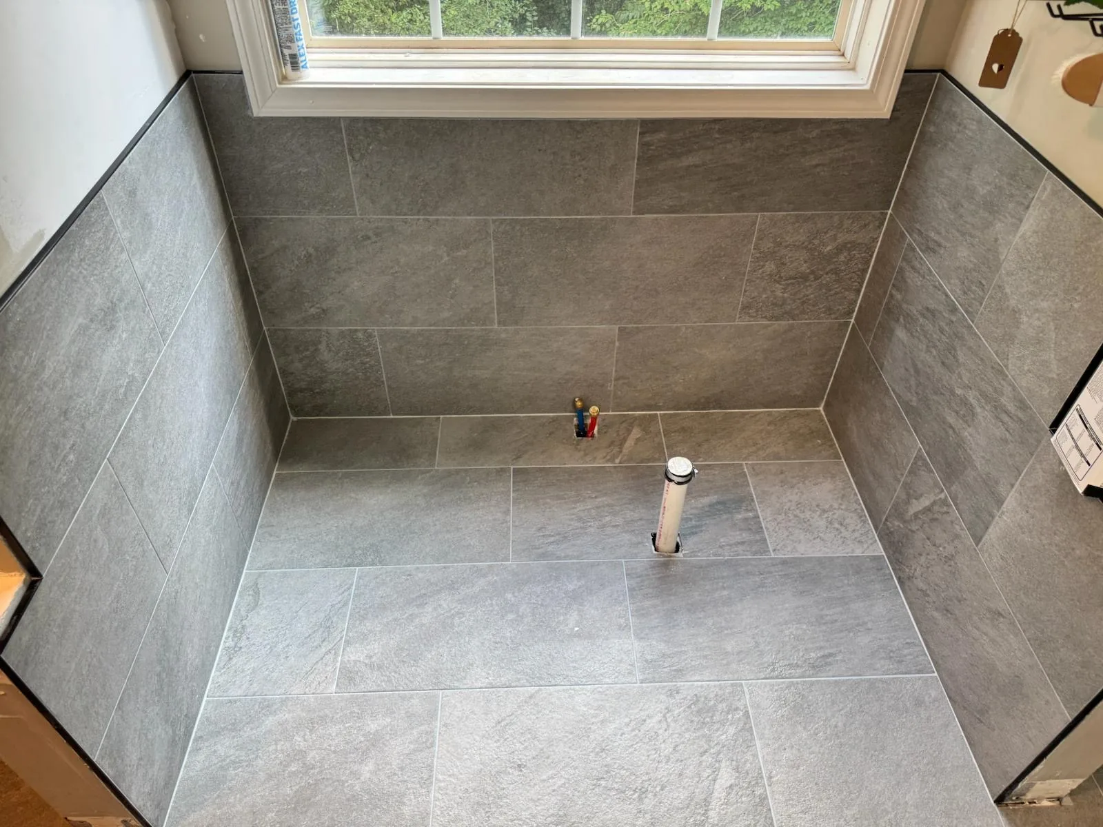 The new tile floor laid before the tub and fixtures went in