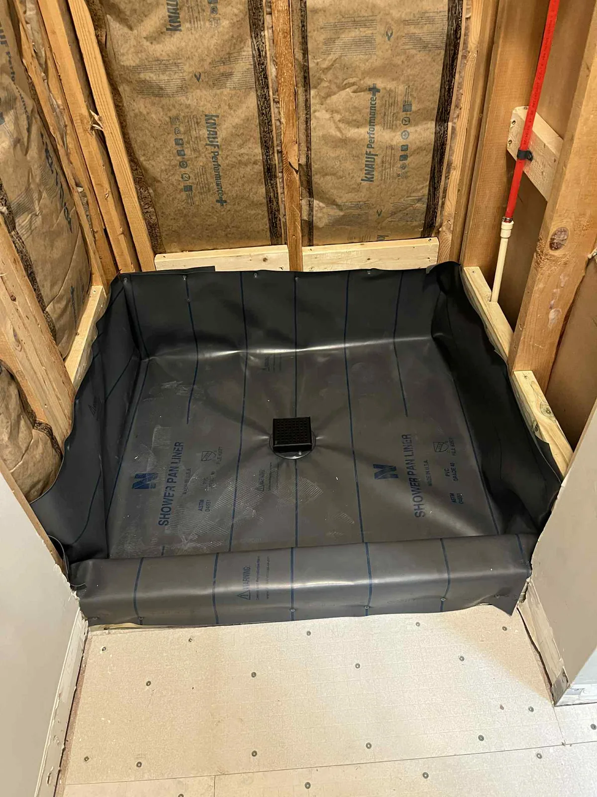 The shower pan liner in and the walls open before the tile went on