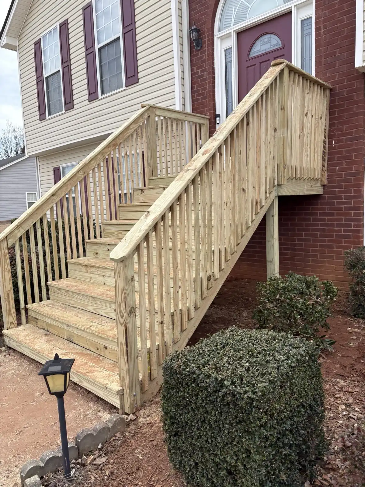 The finished stair from the side, railing and balusters complete