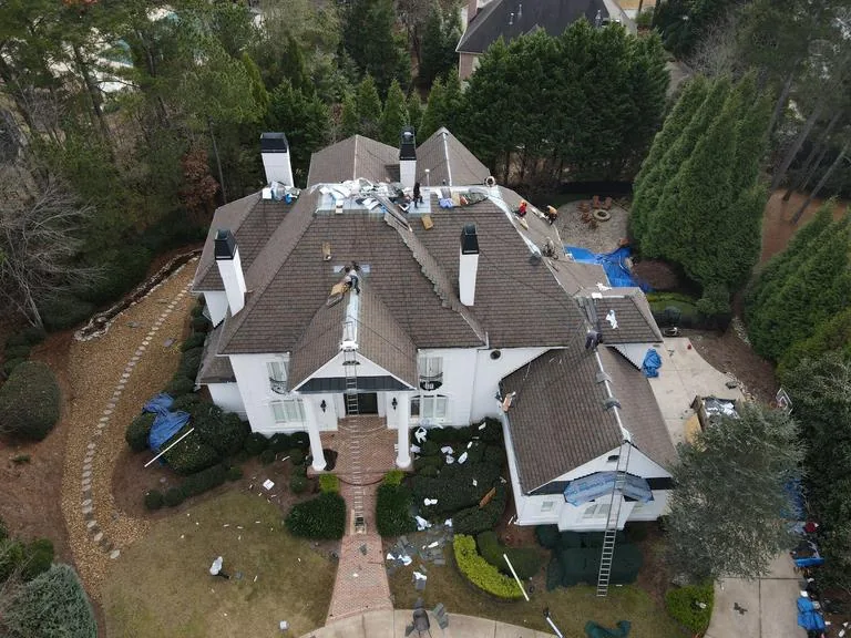 Demo day from above, the crew stripping the old roof